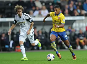 Swansea Prints: Serge Gnabry vs Jose Canas: Intense Battle in Swansea City vs Arsenal Premier League Clash