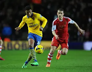 Southampton V Arsenal 2013-14 Prints: Serge Gnabry vs. Steven Davis: A Premier League Showdown at Southampton's St Marys Stadium