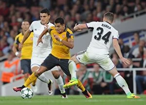Arsenal v FC Basel 2016-17 Collection: Showdown at Emirates: Alexis Sanchez vs. Mohamed Elyounoussi in Arsenal's Champions League Battle
