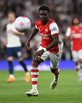 Tottenham Hotspur V Arsenal 2021-22 Prints: Showdown at the Stadium: Bukayo Saka Faces Tottenham in Premier League Clash