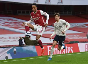 Arsenal V Manchester City 2020-21 Prints: Silent Showdown: Aubameyang vs Stones - Arsenal's Battle Against Manchester City in an Empty Emirates Stadium
