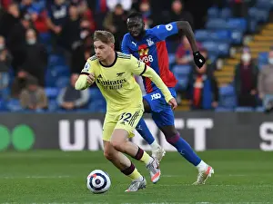Smith Rowe vs. Kouyate: A Battle of Midfielders in the Arsenal vs. Crystal Palace Showdown at Selhurst Park, 2021