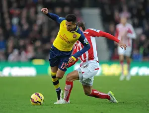 Stoke City V Arsenal 2014-15 Prints: Sneaky Moves: Alexis Sanchez Outwits Marc Muniesa in the Stoke City vs