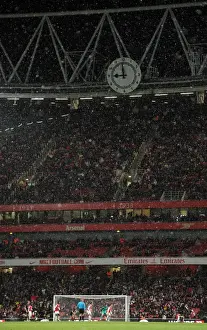 Arsenal V Wigan Athletic - Carlin Cup 2010-11 Prints: Snow falls across the Clock End during the match. Arsenal 2: 0 Wigan Athletic