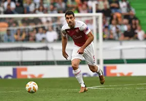 Sporting Lisbon V Arsenal 2018-19 Prints: Sokratis in Action: Arsenal vs. Sporting CP - UEFA Europa League 2018-19