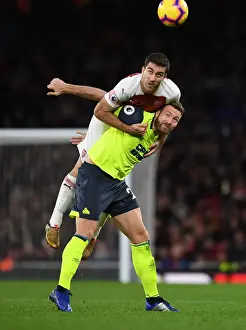 Arsenal V Huddersfield Town - 2018-19 Prints: Sokratis vs. Depoitre: Intense Clash Between Arsenal and Huddersfield Players