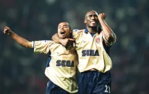 Sol Campbell and Ashley Cole celebrate the Arsenal Championship win