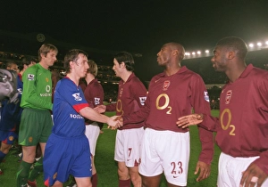 Arsenal v Manchester United 2005-6 Collection: Sol Campbell and Kolo Toure (Arsenal) shake hands with Gary Neville (Man Utd)