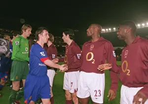 Sol Campbell and Kolo Toure (Arsenal) shake hands with Gary Neville (Man Utd)