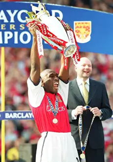 Sol Campbell lifts the F. A. Barclaycard Premiership Trophy