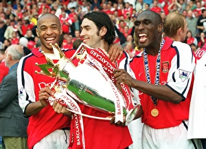 Sol Campbell, Robert Pires and Thierry Henry with the F. A
