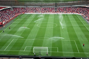 The sprinklers water the pitch at half time