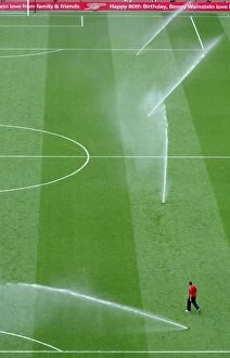 The sprinklers water the pitch at half time