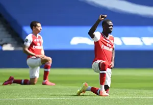 Brighton And Hove Albion V Arsenal 2019-20 Prints: Empty Stands: Pepe Takes a Knee as Arsenal Face Brighton in Pandemic-Hit Premier League