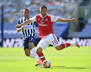 Brighton And Hove Albion V Arsenal 2019-20 Prints: Empty Stands: Sead Kolasinac Breaks Past Neal Maupay in Brighton & Hove Albion vs Arsenal FC (2019-20)