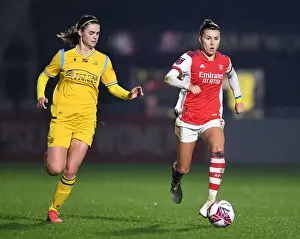 Arsenal Women V Reading Women 2021-22 Prints: Steph Catley vs. Emma Harries: A Fierce Rivalry Unfolds in Arsenal Women vs