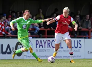 Arsenal Ladies V Wolfsburg 2012-13 Prints: Steph Houghton vs. Viola Odebrecht: A Champion's Showdown in the UEFA Women's Semi-Finals