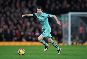 Images Dated 29th December 2018: Stephan Lichtsteiner Faces Off at Anfield: Liverpool vs. Arsenal (2018-19)