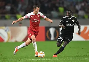 Qarabag V Arsenal 2018-19 Prints: Stephan Lichtsteiner vs Con Delari: A Battle in Arsenal's Europa League Clash against Qarabag