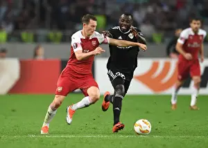 Qarabag V Arsenal 2018-19 Prints: Stephan Lichtsteiner vs Con Delari: Clash in UEFA Europa League Match between Qarabag and Arsenal