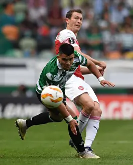 Sporting Lisbon V Arsenal 2018-19 Prints: Stephan Lichtsteiner vs Marcos Acuna: Clash in the Europa League Between Sporting Lisbon and Arsenal