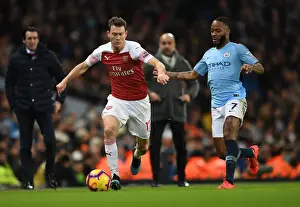 Stephan Lichtsteiner vs. Raheem Sterling: A Premier League Showdown at Etihad Stadium