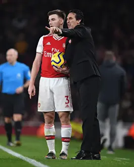 Strategic Discussions: Unai Emery and Kieran Tierney at Arsenal's Emirates Stadium