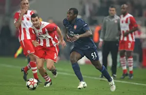 Olympiacos V Arsenal 2009-10 Prints: Sunu Shines: Arsenal's Victory Over Olympiacos (Gilles Sunu vs Giorgos Galitsios)