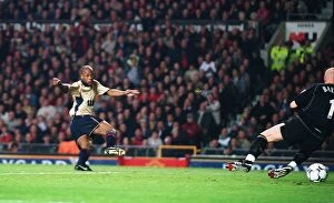 Images Dated 7th April 2005: Sylvain Wiltord shoots past Manchester United goalkeeper Fabien Barthez to score the Arsenal goal th
