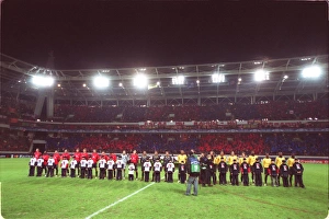 The two teams line up before the match