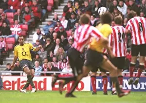 Theirry Henry shoots past Sunderland goalkeeper Kelvin Davis to score the 3rd Arsenal goal from a fr