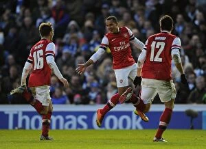 Images Dated 26th January 2013: Theo Walcott, Aaron Ramsey, and Olivier Giroud Celebrate Goals in Arsenal's FA Cup Victory over
