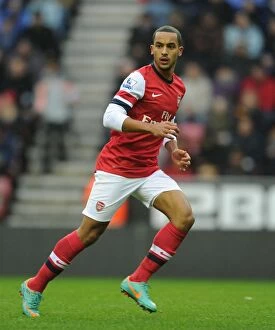 Images Dated 22nd December 2012: Theo Walcott in Action: Wigan Athletic vs. Arsenal, Premier League 2012-13