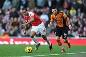 Images Dated 12th February 2011: Theo Walcott (Arsenal) Adam Hammill (Wolves). Arsenal 2: 0 Wolverhampton Wanderers