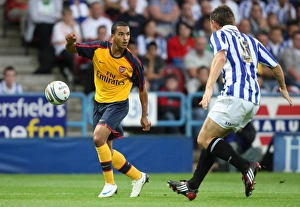 Huddersfield v Arsenal 2008-09 Collection: Theo Walcott (Arsenal) Andy Butler (Huddersfield)