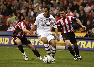 Theo Walcott (Arsenal) Chris Armstrong and Chris Morgan (Sheff)