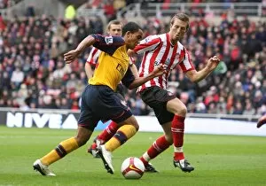 Images Dated 4th October 2008: Theo Walcott (Arsenal) Danny Collins (Sunderland)