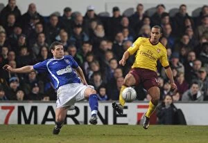 Images Dated 12th January 2011: Theo Walcott (Arsenal) Darren O Dea (Ipswich). Ipswich Town 1: 0 Arsenal