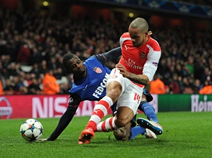Arsenal v Monaco 2104/15 Collection: Theo Walcott (Arsenal) Elderson (Monaco). Arsenal 1: 3 AS Monaco. UEFA Champions League