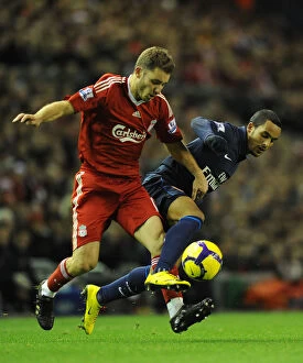 Liverpool v Arsenal 2009-10 Gallery: Theo Walcott (Arsenal) Fabio Aurelio (Liverpool). Liverpool 1: 2 Arsenal