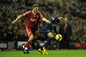 Liverpool v Arsenal 2009-10 Gallery: Theo Walcott (Arsenal) Fabio Aurelio (Liverpool). Liverpool 1: 2 Arsenal