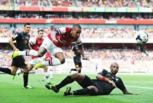 Arsenal v Galatasaray 2013-14 Gallery: Theo Walcott (Arsenal) Felipe Melo (Galatasaray). Arsenal 1: 2 Galatasaray. Emirates Cup Day Two