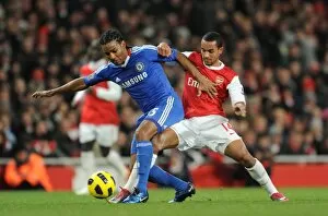 Images Dated 27th December 2010: Theo Walcott (Arsenal) Flourent Malouda (Chelsea). Arsenal 3: 1 Chelsea