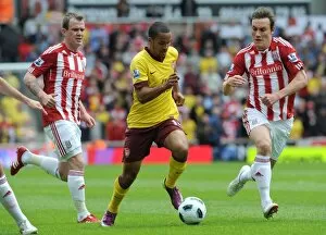 Images Dated 8th May 2011: Theo Walcott (Arsenal) Glen Whelan and Dean Whitehead (Stoke). Stoke City 3: 1 Arsenal