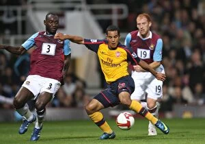 Images Dated 26th October 2008: Theo Walcott (Arsenal) Herita Ilunga and James Collins (West Ham)