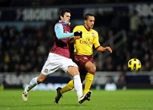 West Ham United v Arsenal 2010-11 Collection: Theo Walcott (Arsenal) James Tomkins (West Ham). West Ham United 0: 3 Arsenal
