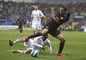 Images Dated 31st March 2008: Theo Walcott (Arsenal) JLloyd Samuel (Bolton)