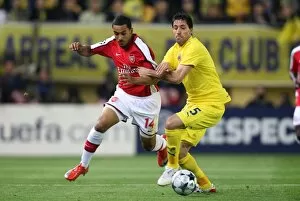 Images Dated 9th April 2009: Theo Walcott (Arsenal) Joan Capdevila (Villarreal) before the match