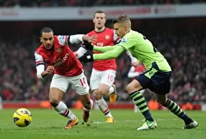 Images Dated 23rd February 2013: Theo Walcott (Arsenal) Joe Bennett (Villa). Arsenal 2: 1 Aston Villa. Barclays Premier League