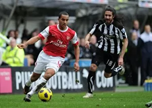 Newcastle United v Arsenal 2010-11 Collection: Theo Walcott (Arsenal) Jonas Gutierrez (Newcastle). Newcastle United 4: 4 Arsenal